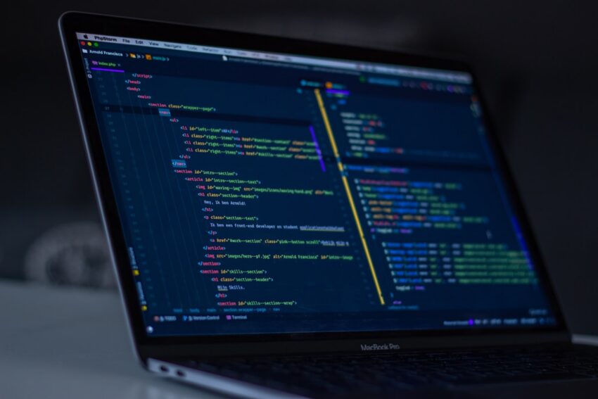 Code editor screen glowing in a dark room while debugging a cache bug